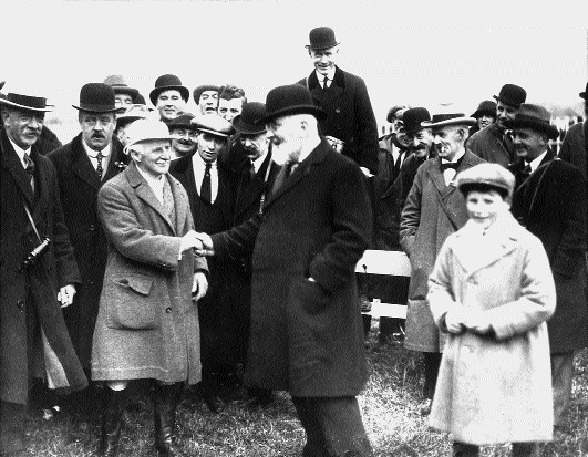 1923 - Mr T.M. Healy, Governor General of the Irish Free State, congratulating Harry Beasley (aged 72) on riding his own horse to victory in the Maiden Plate.