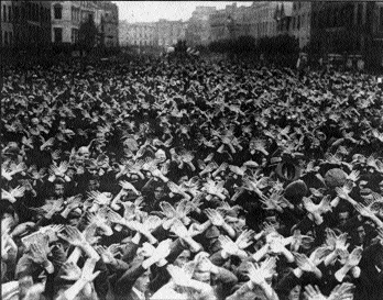 Irish Christian Front demonstrators in Cork make the sign of the cross above their heads. (Cork Examiner, 21 September 1936)