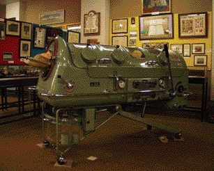 ‘Iron lung' c. 1950s-one survivor described the experience as similar to lying in a coffin with one's head sticking out.