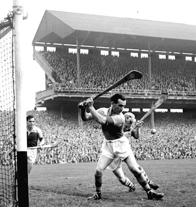 Action from the 1956 All-Ireland hurling final. Cork got to (and were beaten in) both hurling and football finals. Both matches were postponed at the request of Dublin health authorities worried by the prospect of large numbers of Cork people descending on Croke Park. (Cork Examiner)