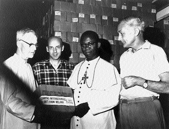 Limerick-born Bishop Joseph Whelan of Owerri (left) accepts Caritas aid flown in from Sao Tomé. The Nigerian federal government claimed that aid flights were a cover for gun running. (Independent Newspapers)
