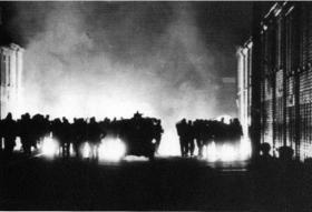 A line of RUC and B-Specials moves along Hooker Street in Catholic Ardoyne on the night of 14/15 August 1969, backlit by the fires of loyalist arsonists (note the absence of street lights, already shot out by police). Two Catholics were killed by the RUC and B-Specials in the Ardoyne area, and one Protestant on the nearby Crumlin Road by nationalist gunmen. The Scarman Tribunal later found that on several occasions, as the RUC and B-Specials pushed Catholics back, loyalist mobs followed in their wake, burning houses as they went. (Belfast Telegraph) 