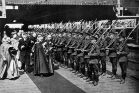 The papal legate, accompanied by de Valera, blesses the military guard of honour. Excommunicated from the church during the Civil War, the congress provided de Valera with the opportunity to demonstrate his Catholic bona fides. (Multitext Project)
