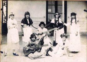 A carnival party at Youngs ranch c. 1930s. Sara and Louise Young (with guitars) and their friends wear fancy dress representing Argentinian native women. (Centro Argentino Irlandés de San Pedro)