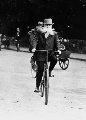 John Boyd Dunlop testing out his own invention—a bicycle with pneumatic tyres.