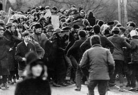 Burntollet bridge, January 1969—loyalist ambushers coming from the Ardmore road openly attack the front rank of the People’s Democracy march unimpeded by the RUC presence. (Belfast Telegraph)