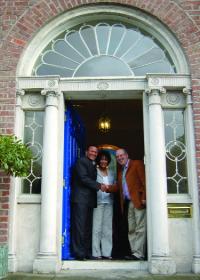 great-great-granddaughter Nettie Washington Douglass and her son Kenneth Morris being greeted by the director of the Keough Naughton Notre Dame Centre, Kevin Whelan, at the doorway of 58 Merrion Square, once the residence of Daniel O’Connell and now home of the Centre. (George K. Warren)