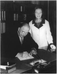 President De Valera signing the Credit Union Act in 1966;with Nora Herlihy. (Courtesy of The Irish League of Credit Unions) 