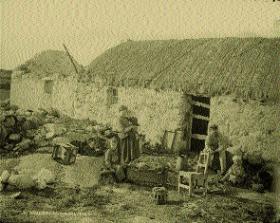 An evicted family on the Hill estate, Gweedore, Co. Donegal, c. 1887. The few belongings scattered outside include a skillet pot, a chair, a stave-built water vessel, a child’s cradle, a child’s chair and the hub of a cart-wheel.