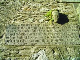 Text on the wall of the Kells bell-tower, saying that it was rebuilt in 1578 by Bishop Hugh Brady and Archdeacon John Garvey. (Tara McGovern)