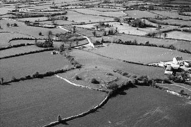 An enclosure crowning Tulach Mac Amhalghaidh (at centre of picture), the gathering place of the Magawleys of Calary, near Moate, County Westmeath.