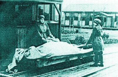 Two women loading a bogey car-the factory had an extensive network of bogey tracks to facilitate the movement of chemicals and explosives around the site. (G.D. Kelleher, Gunpowder to guided missiles) 