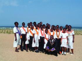 Togbi Subo II (front), Superintendent of Juniors of the Grand Lodge of Ghana and Ewe chief, with juniors from two of Ghana’s juvenile Orange lodges after a 2004 district meeting at Keta.