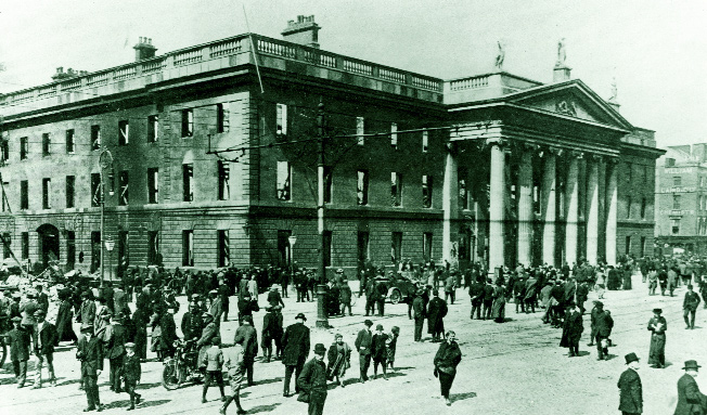Life gets back to normal after the Rising outside the ruins of the GPO. (National Museum of Ireland)