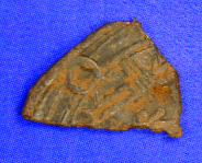 Arabic coin fragments such as this found during excavations may accurately date the site once they are analysed. (ACS)