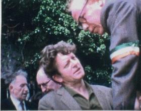 IRA chief of staff Cathal Goulding, Sinn Féin president Tomás Mac Giolla (behind) and Jim Sullivan (wearing armband) at Bodenstown, June 1969—in April 1969 Goulding told BBC radio that ‘if our people in the six counties are oppressed and beaten up . . . then the IRA will have no alternative but to take military action’. (Seamus Murphy)