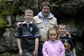 Diarmuid Gavin with the three pupils from a County Clare class found to have genetic markers similar to a local Stone Age sample