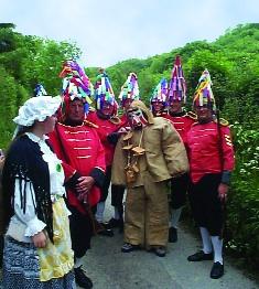 ‘Hunting the Earl of Rone’ (the figure dressed in brown) in Combe Martin, north Devon. (Tom and Barbara Brown)