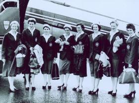 Thelma Hopkins (second left), Maeve Kyle (third right) and Mary Peters (second right) departing for the 1958 Empire Games, Cardiff. (Seán and Maeve Kyle)