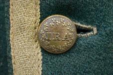 Brass buttons inscribed ‘IRA’, the first use of the term ‘Irish Republican Army’. (Parks Canada)