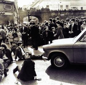 Young people assembled on Guildhall Square to protest after 5 October 1968. Only 400 or so people had taken part that day; when the march was restaged a month later, almost 40 times that number participated.