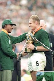 The real-life Nelson Mandela presenting the Webb Ellis Rugby World Cup to Springboks captain François Pienaar in 1995.