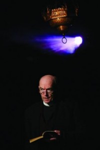 The monsignor (Bosco Hogan) would rather be at home reading Herman Hesse. The other presence in the play is the sanctuary lamp itself, casting the other characters into the shadows.