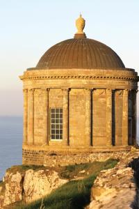 Mussenden Temple, the bishop’s library, a replica of the Roman Temple of Vesta, perched precariously on the jagged basalt cliffs at Castlerock, Co. Derry