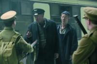 One of the early scenes from Ken Loach’s The wind that shakes the barley (2006)—train-driver and trade unionist Dan (Liam Cunningham, centre) refuses British soldiers access to the train. He later becomes an IRA volunteer and, while expressing opposition to the Treaty, reminds fellow volunteers that they are ‘paupers just like me’, and that ‘the IRA are [now] backing the landlords and crushing people like you and me’. (Pathé Films)