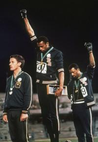 US athletes Tommie Smith (200m gold) and John Carlos (bronze) raise their fists in a Black Power salute at the 1968 Mexico games, for many Irish people the first televised games they saw.