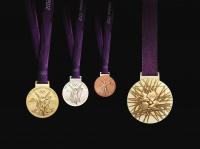 The gold, silver and bronze medals (and reverse) that will be awarded at the 2012 London Olympics. The London games of 1908 were the first in which gold, silver and bronze medals were officially awarded.