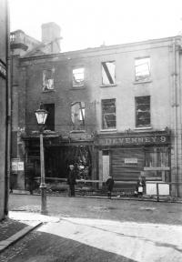 A burnt-out Catholic-owned shop in Bow Street, Lisburn, in August 1920. (Mooney Collection)
