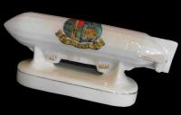 The First World War stimulated sales of new miniatures, such as these battleships for Antrim and Tipperary, and a Zeppelin for Kildare.
