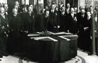 Sir Edward Carson (with James Craig to his left) signing the Solemn League and Covenant in Belfast City Hall on ‘Ulster Day’, 28 September 1912, the culmination of a range of stunningly impressive events masterminded by Craig. (George Morrison)