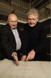 Series consultant Terence Dooley (left) and presenter Bryan Murray (right) consult estate records to pick out relevant material that illuminates the reality of what we see and hear in the other sections. (All images: Big Mountain Productions)
