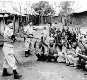 Suspect insurgents held by British troops during the Mau Mau rebellion in Kenya, 1954. (Popperfoto)