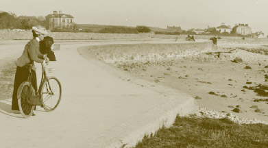 A female cyclist at Salthill, Co. Galway. The pneumatic-tyred safety bicycle was particularly welcomed by middle-class girls and women, as it freed them, at least temporarily, from the stuffy confines of their homes and provided opportunities for exercise and enjoyment that appeared revolutionary and even emancipatory to them and their contemporaries. (NLI)