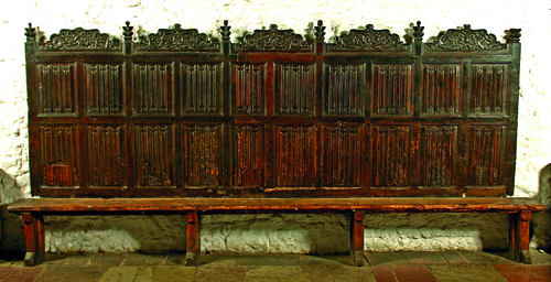 A fifteenth-century settle (wall bench) and an oak cupboard. Furniture, kitchen utensils and bedlinen were carefully tended and inventoried in people’s wills. (Bunratty Castle Medieval Collection)