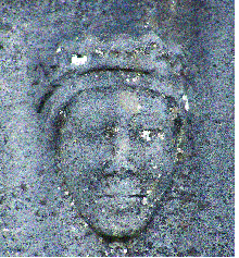 Carved head, probably of the Virgin Mary, on the south wall of the chapel at Kilcorban friary.