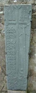 A grave-slab in Clonca, Inishowen, showing a camán and ball.