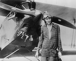 Above: Amelia Earhart in front of her biplane, Friendship, in Newfoundland, 14 June 1928. (Getty Images)
