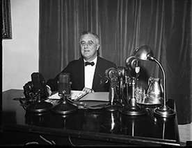 President Franklin D. Roosevelt about to broadcast one of his famous ‘fireside chats’. As a part of the Second New Deal he approved the establishment of the Works Progress Administration (WPA). (Library of Congress)