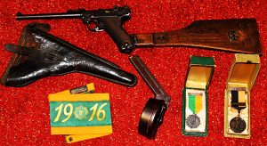 Above: Some of the artefacts on display in Revolution 1916 in the Rotunda—German artillery Luger pistol given to Irish Volunteers in 1915 by a U-boat captain, with stock handle, holster and a 50-round trammel magazine; 1916 armband and medals. (All Irish Volunteers Commemorative Organisation Collection/Bartle D’Arcy)